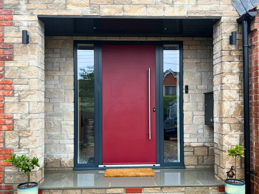 Red entrance door with glazed sidelights from The Custom Door Company gallery